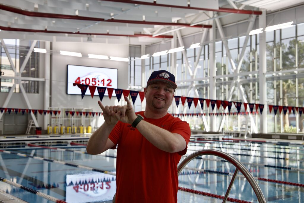 Utah Tech swim coach named WAC coach of the year, gives credit to team